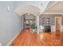 Open foyer featuring hardwood floors, skylight, staircase, and entrance to the living and dining rooms at 6057 Erie View Ct, Denver, NC 28037