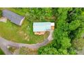 Aerial view of home showcasing its mature trees, expansive yard, and proximity to the lake at 6294 Southlake Dr, Hickory, NC 28601