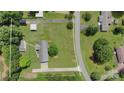 Aerial view of the property highlighting the home, driveway, and surrounding greenery at 7869 Cherry Point Dr, Denver, NC 28037