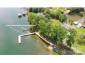 Aerial view of property with lake access, featuring a boat ramp and picnic area for outdoor enjoyment at 7869 Cherry Point Dr, Denver, NC 28037