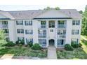 Three-story condo building shows off its symmetrical facade, balconies, and well-kept landscaping at 1023 Triece Ln, Charlotte, NC 28215