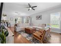 Open-concept living area featuring a comfortable sectional sofa, hardwood floors, and modern decor at 1067 33Rd Avenue Ne Loop, Hickory, NC 28601