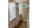 Bathroom with granite countertop, white cabinets, and storage at 136 Ridge Run Dr, Statesville, NC 28625