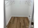 Spacious walk-in closet with wood flooring and shelving at 136 Ridge Run Dr, Statesville, NC 28625