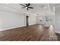 Open-concept living area boasts hardwood floors, recessed lighting, white trim, and a view into the bright kitchen at 1644 Dresden St, Rock Hill, SC 29732