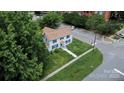 A captivating aerial perspective of a two-story home with beautiful lawn and mature trees in the surroundings at 315 E Washington Ave, Bessemer City, NC 28016