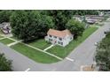 Charming two-story house with traditional architecture, complemented by lush green lawn and mature shade trees at 315 E Washington Ave, Bessemer City, NC 28016