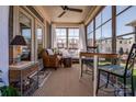 Cozy sunroom with comfortable seating, natural light, and beautiful views of the outdoors at 4014 Pleasant Run Dr, Stallings, NC 28227
