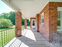 Covered porch with brick columns, providing a shaded and inviting outdoor space at 435 W Whitley St, Norwood, NC 28128