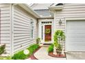 Inviting front entrance with a decorative wreath, and beautiful landscape at 539 Turquoise Way, Fort Mill, SC 29708