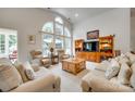 Bright living room features a large window and comfortable seating at 539 Turquoise Way, Fort Mill, SC 29708