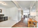 Warm and inviting foyer featuring gleaming hardwood floors and neutral paint at 7930 Kelburn Ln, Charlotte, NC 28273