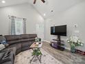 Inviting living room with vaulted ceiling, modern decor, and abundant natural light at 900 4Th St, Spencer, NC 28159