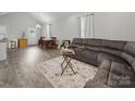Bright, open living area with gray vinyl floors, perfect for entertaining and relaxing at 900 4Th St, Spencer, NC 28159