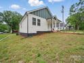 A well-maintained home with manicured landscaping, showcasing its curb appeal at 900 4Th St, Spencer, NC 28159
