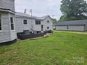 Large backyard with patio area and detached garage/storage building at 905 Klondale St, China Grove, NC 28023