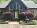 Inviting front entrance with stone path and mature landscaping at 1115 John Short Rd, Indian Land, SC 29707