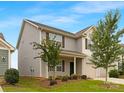 Charming two-story home with a two-car garage, inviting front porch and mature landscaping at 124 Canada Dr # 45, Statesville, NC 28166