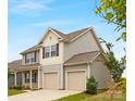 Charming two-story home featuring a two-car garage and gray siding at 124 Canada Dr # 45, Statesville, NC 28166