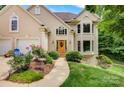 Beautiful home exterior with a well-manicured lawn, lovely garden, and an inviting entrance at 133 37Th Avenue Nw Pl, Hickory, NC 28601