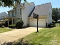 Charming two-story home with a well-manicured front yard and a two car garage at 2567 Holly Oak Ln, Gastonia, NC 28056