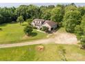 Home featuring dormer windows, a welcoming front porch, an expansive green lawn and attached garage at 2818 Neill Rd, Lancaster, SC 29720