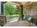 Inviting front porch featuring a comfortable bench overlooking a landscaped lawn at 3204 Mcpherson St, Waxhaw, NC 28173