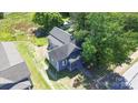 Charming home features a traditional design, mature trees, and a spacious yard at 3209 Lowell Rd, Gastonia, NC 28054