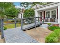 Close up of the front porch with ramp access and cozy seating at 34 Admiral Sw Ave, Concord, NC 28027