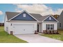 Charming single-Gathering home with a two-car garage, attractive landscaping, and inviting curb appeal at 3475 Saddlebred Dr, Gastonia, NC 28052