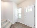 Bright entryway boasting fresh paint, stairs, and wood-look flooring at 403 Park Meadows Dr, Matthews, NC 28104