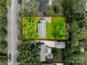 Aerial view showing the property lines, roof, and surrounding lush greenery at 409 Scaleybark Rd, Charlotte, NC 28209