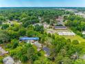 Wide aerial view showing property location within a neighborhood with plenty of trees at 409 Scaleybark Rd, Charlotte, NC 28209
