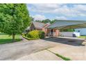 Side angle of a brick home with a covered carport and driveway at 500 Belleview Rd, Rock Hill, SC 29730