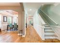 Elegant foyer with hardwood floors, wainscoting detail, and an open view into the formal dining room at 85017 Newloch Ct, Lancaster, SC 29720