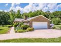Side view of the property highlighting the 2-car garage and meticulous landscaping at 2078 Valley View Ln, Lincolnton, NC 28092