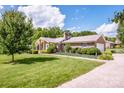 Beautiful brick home with lush lawn, mature trees and a side-entry garage at 2078 Valley View Ln, Lincolnton, NC 28092