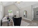 Cozy living room with vaulted ceilings, modern décor and stylish black accent chair at 213 E Division Ave, Salisbury, NC 28144