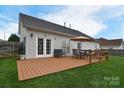 Relaxing backyard deck with outdoor seating and barbecue area, ideal for entertaining guests at 2836 Rosemeade Dr, Monroe, NC 28110