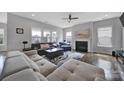 Bright living room featuring hardwood floors, a fireplace, and large windows at 3255 Split Rail Ln, Lancaster, SC 29720