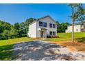 Two-story home with a gravel driveway at 415 Kickapoo Ave, Gastonia, NC 28056