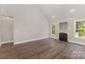 Neutral living room showcases hardwood floors, fireplace, and plenty of natural light at 6655 Maple Spring Ct, Denver, NC 28037