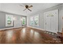 Bright living room boasts hardwood floors, a decorative fireplace, and ample natural light at 725 W Graham St, Shelby, NC 28150
