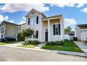 Inviting two-story home with a well-manicured lawn and inviting curb appeal on a sunny day at 8605 Sawleaf Ct, Charlotte, NC 28215