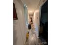 Long hallway with updated flooring and neutral paint, great flow into other rooms at 8827 Spring Meadow Dr, Hickory, NC 28601