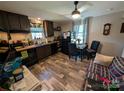 Cozy eat-in kitchen features updated flooring, cabinets, and appliances at 8827 Spring Meadow Dr, Hickory, NC 28601