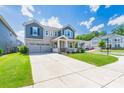 Beautiful two-story home with a manicured lawn and a spacious driveway at 1004 Earlston Rd, Indian Trail, NC 28079