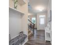 Inviting foyer with hardwood floors, coat rack and view of stairs and dining room at 1004 Earlston Rd, Indian Trail, NC 28079
