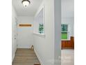 Bright entryway features wood floors and views into other living spaces at 1038 Blake Rd, Albemarle, NC 28001