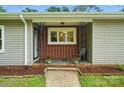 A covered front porch with brick accents and decorative ironwork is inviting at 1038 Blake Rd, Albemarle, NC 28001